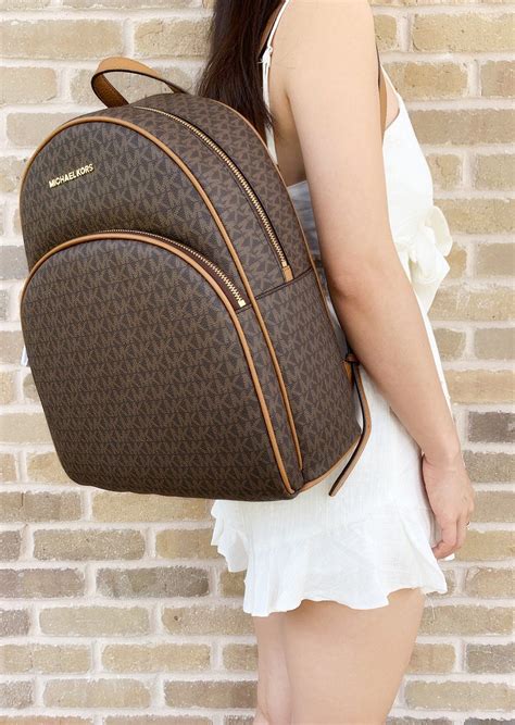 michael kors brown bag 2015|Michael Kors brown leather backpack.